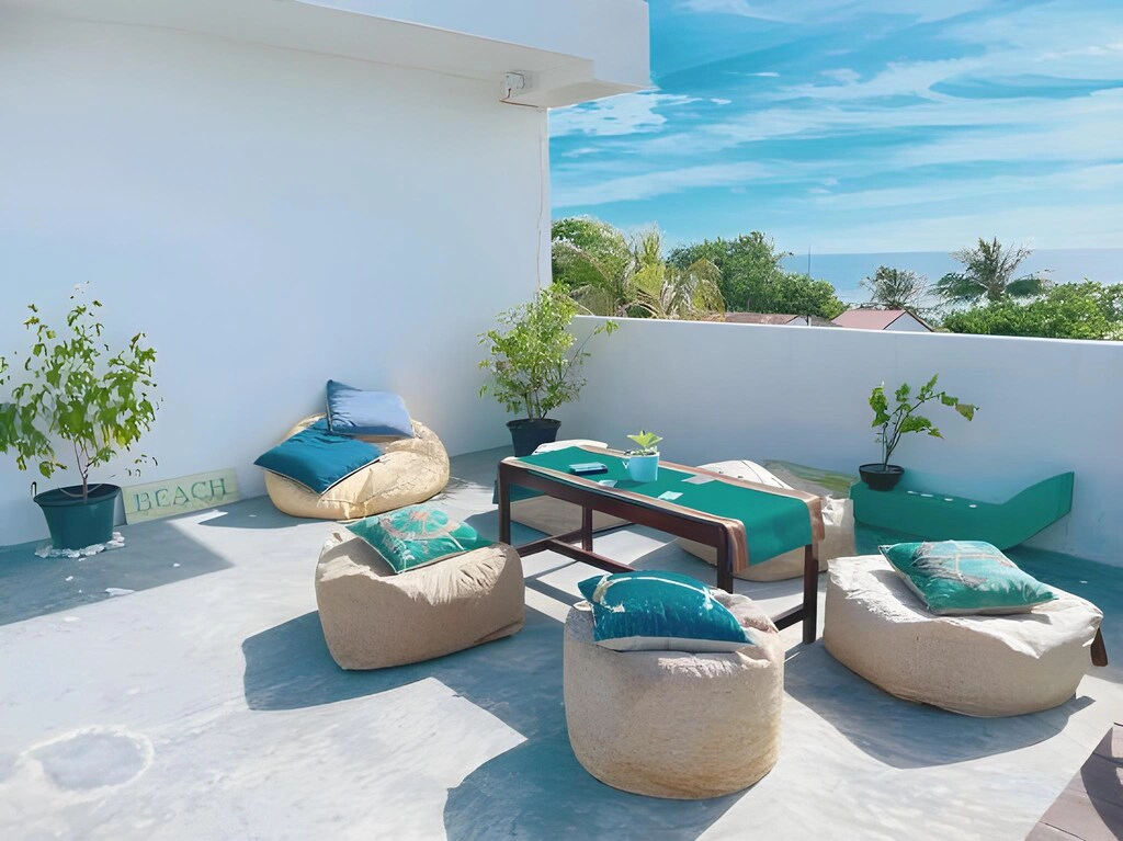 Aquzz Hotel rooftop terrace with ocean view